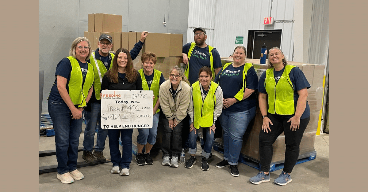 group of individuals volunteering at Feeding South Dakota facility